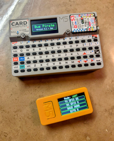 A photo of the ESP32 Bus Pirate firmware running on M5 Stack devices